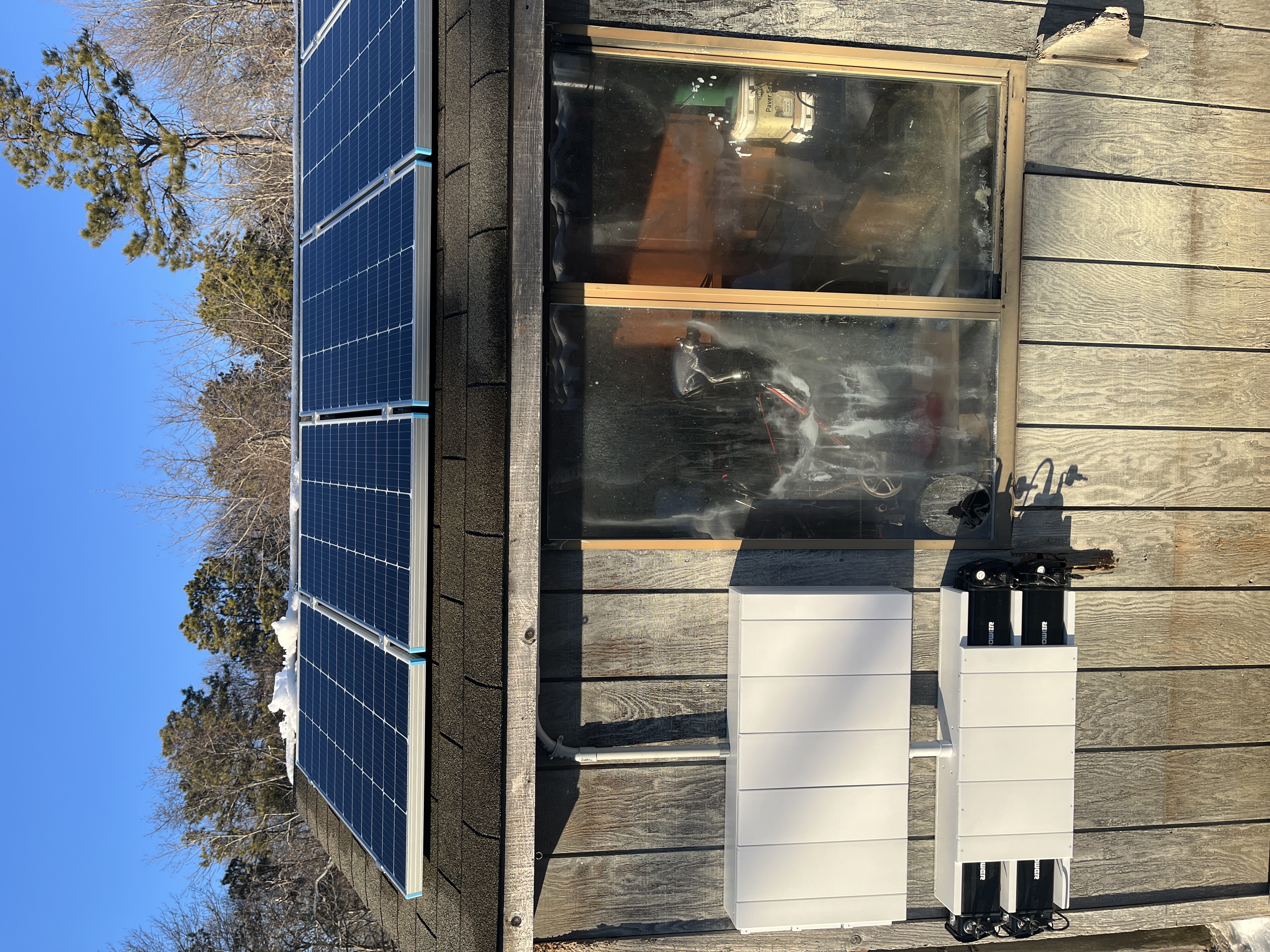 Hyperion's battery swapping prototype including a view of the solar panels on the shed roof